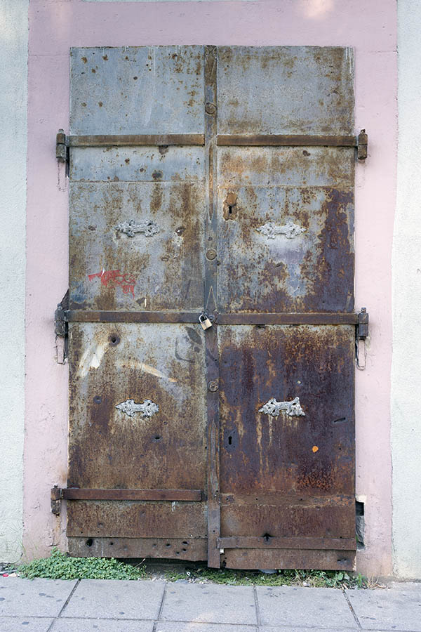 Photo 26254: Decayed, grey, brown, and rusty metal plate double door
