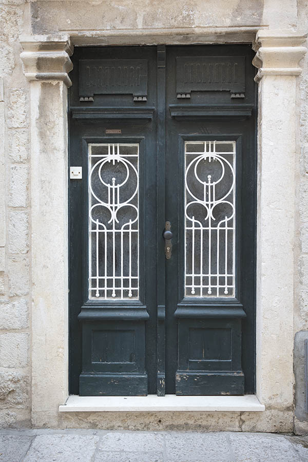 Photo 26292: Panelled, carved, teal double door with latticed door lights