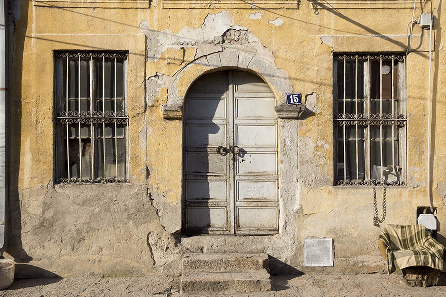 Photo 26369: Facade with grey, formed double door and two latticed windows