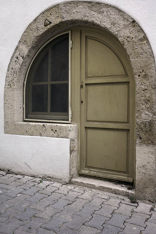 Photo 26621: Formed, light green window and door in a sandstone frame