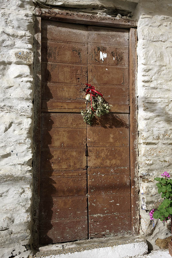 Photo 26777: Worn, narrow, brown double door of boards