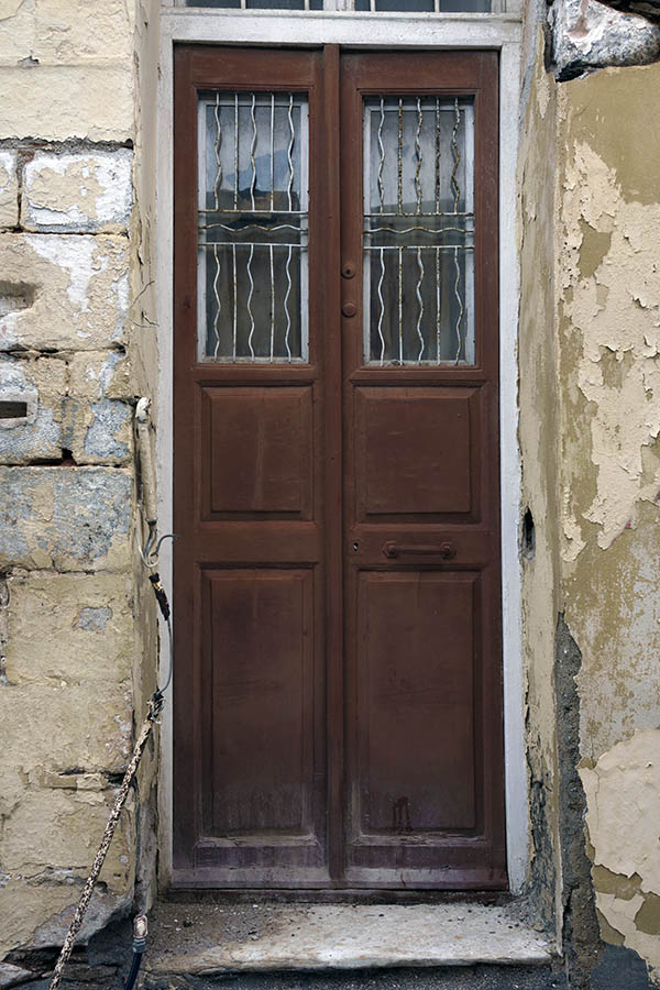 Photo 26865: Narrow, brown, panelled double door with white lattice in a white frame
