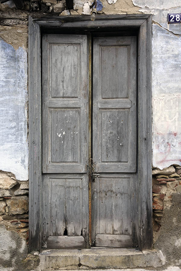 Photo 26890: Decayed, unpainted, panelled double door