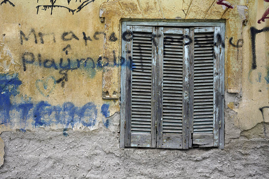 Photo 26919: Decayed, unpainted and teal shutters