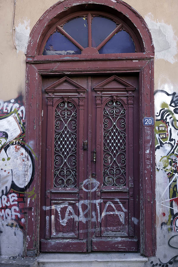 Photo 26938: Large, worn, panelled, carved, purple double door with fan light and lattice