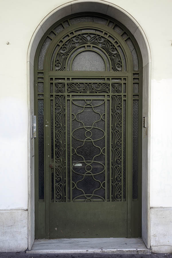 Photo 26956: Large, formed, dark green metal door with fan light and matted glass