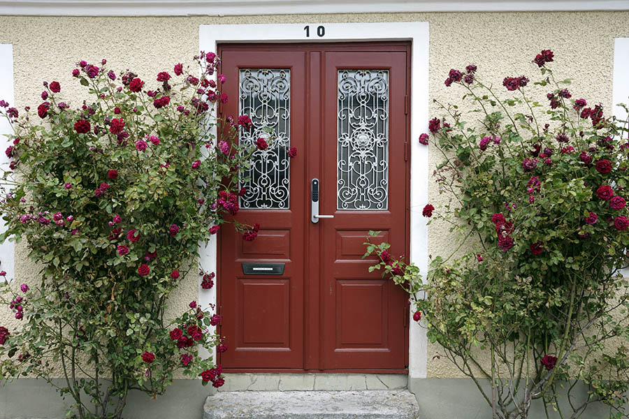 Photo 27080: Panelled, red double door with door lights and white lattice