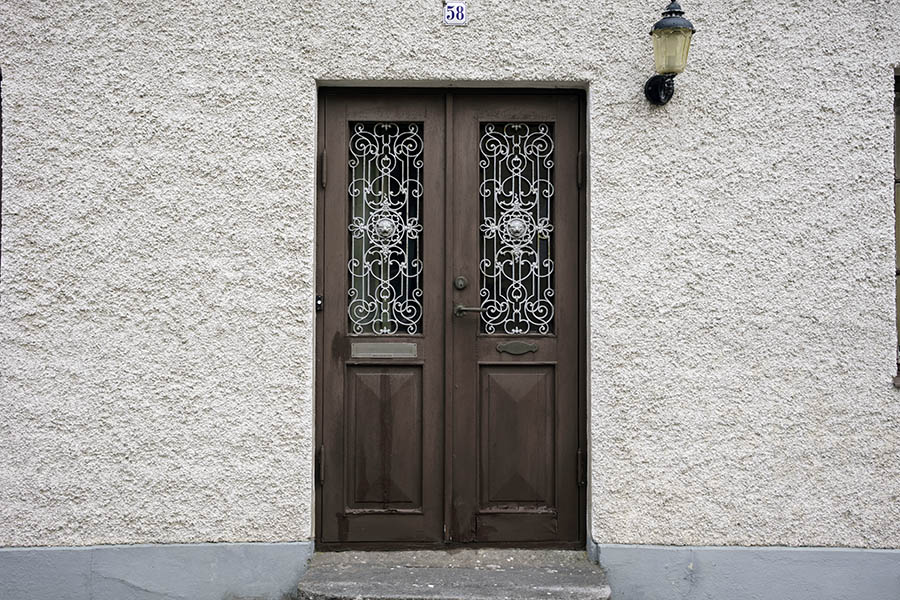 Photo 27108: Panelled, brown double door with white lattice