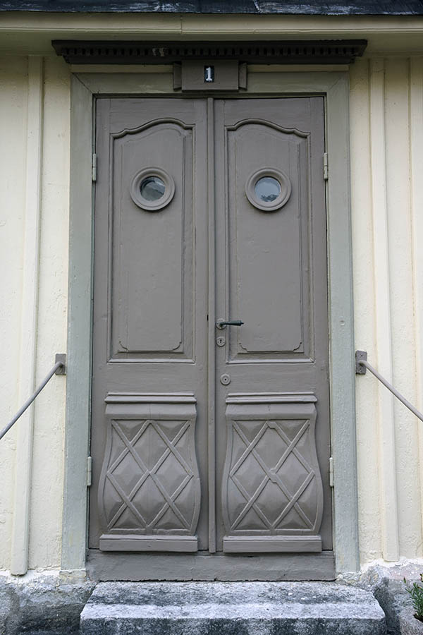 Photo 27176: Panelled, carved, grey double door with round door lights. 
