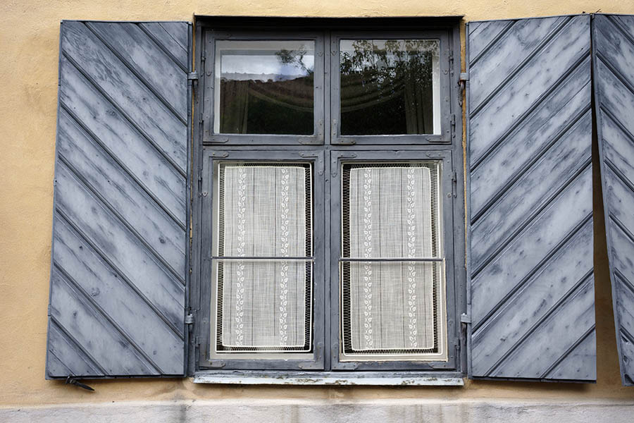 Photo 27291: Teal window with two frames, six panes and shutters of diagonal boards
