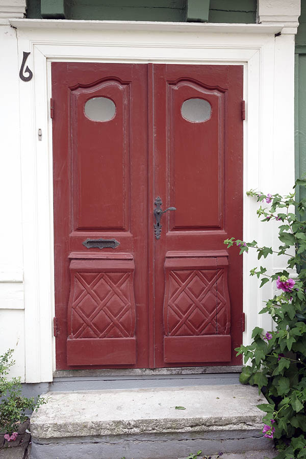 Photo 27296: Carved, panelled, red double door with oval door lights in a white frame