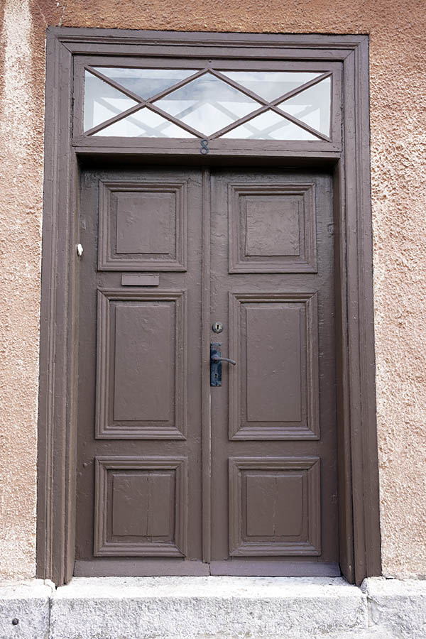 Photo 27316: Worn, panelled, brown double door with top window