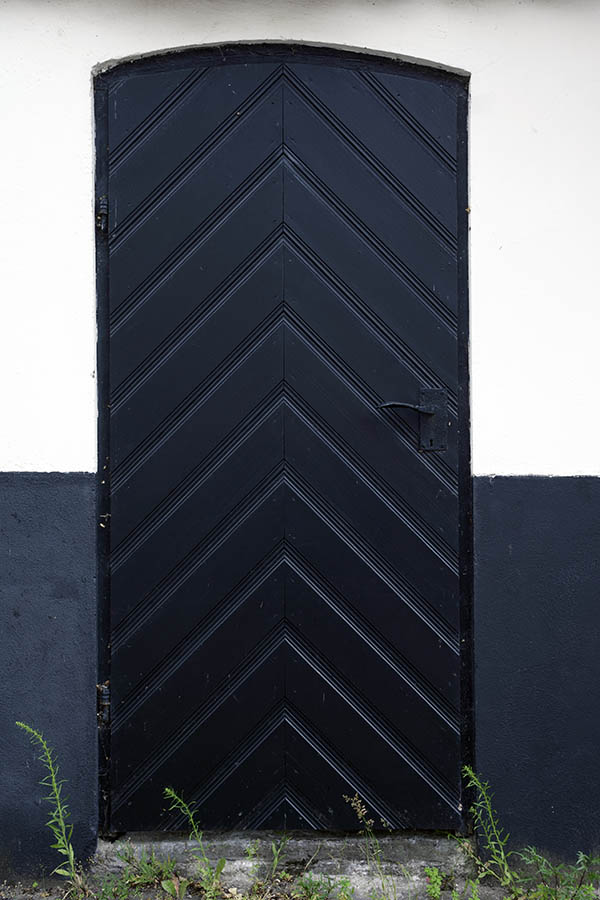 Photo 27341: Black door of diagonal boards