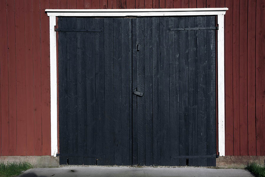 Photo 27354: Black gate of boards in a white frame