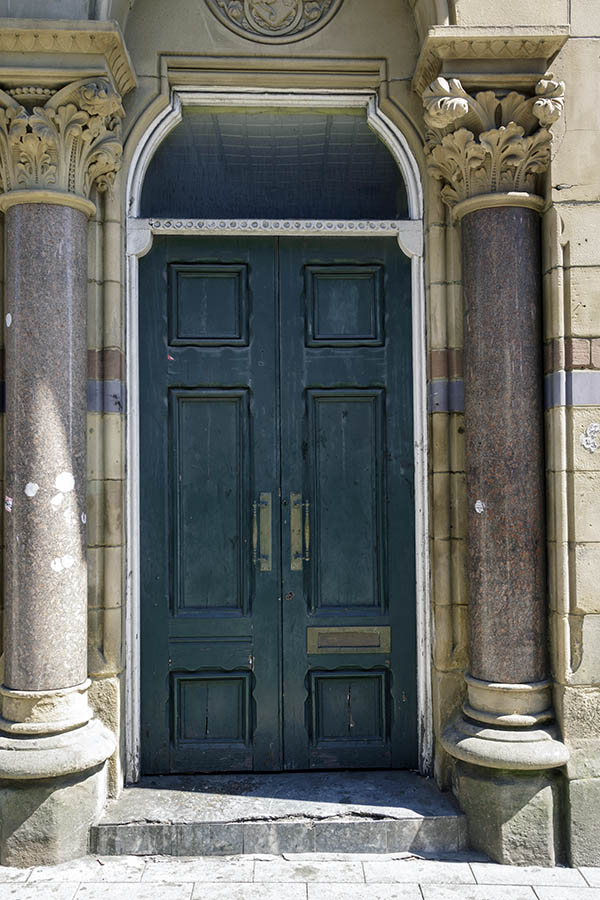Photo 27372: Carved, panelled, teal double door in a white, carved frame with fan light