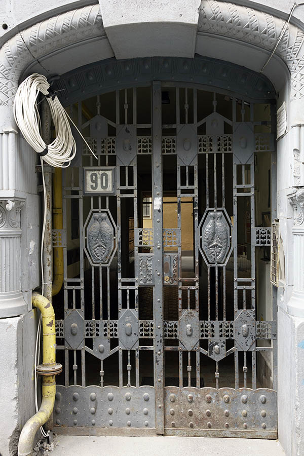 Photo 27380: Worn, grey metal gate in Art Nouveau style