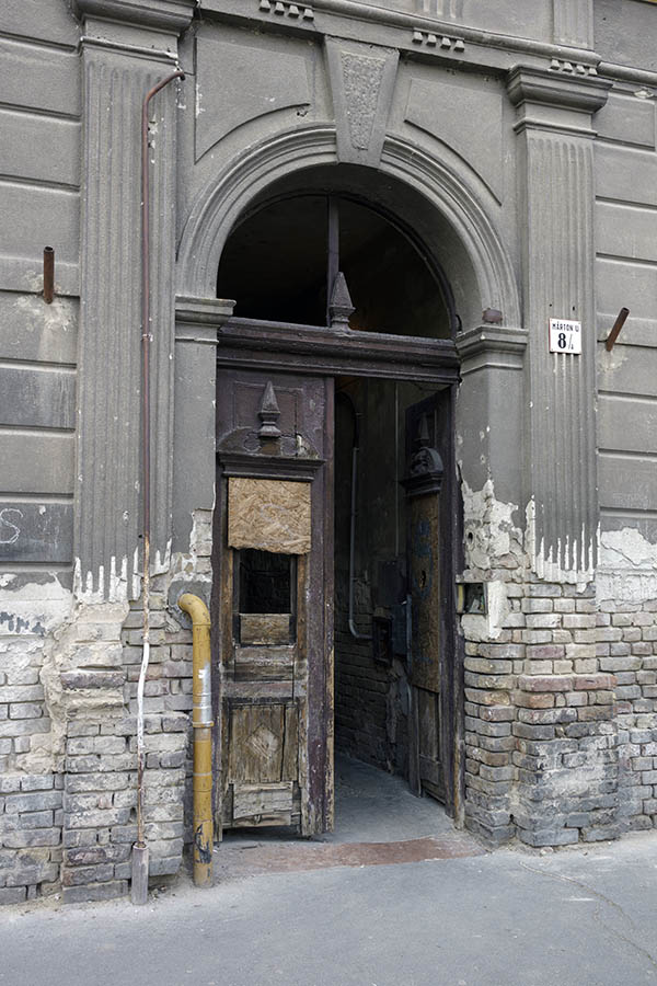 Photo 27381: Decayed, carved, purple gate with fan light with plastered pilastre