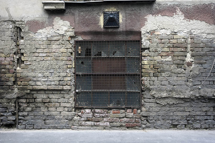 Photo 27384: Worn, brown, rusty, latticed window