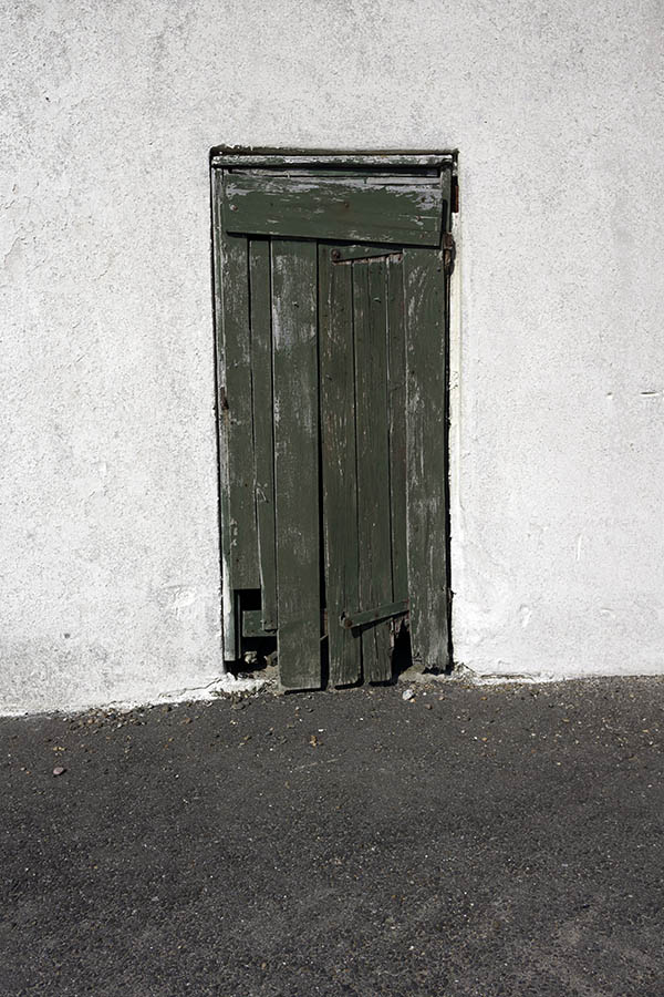 Photo 27395: Decayed, unpainted, green door of boards