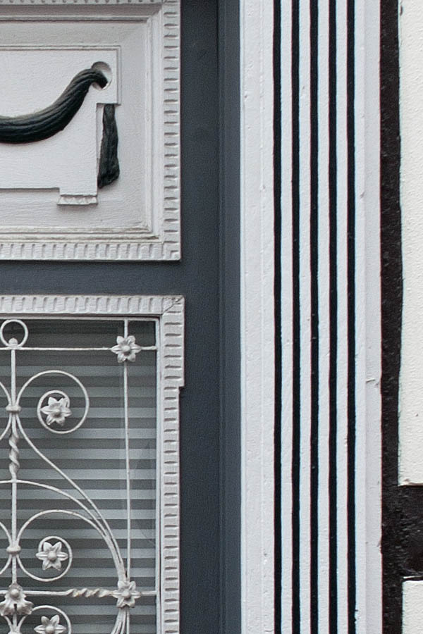 Photo 00235: Huge, panelled, carved double door in grey and white colours