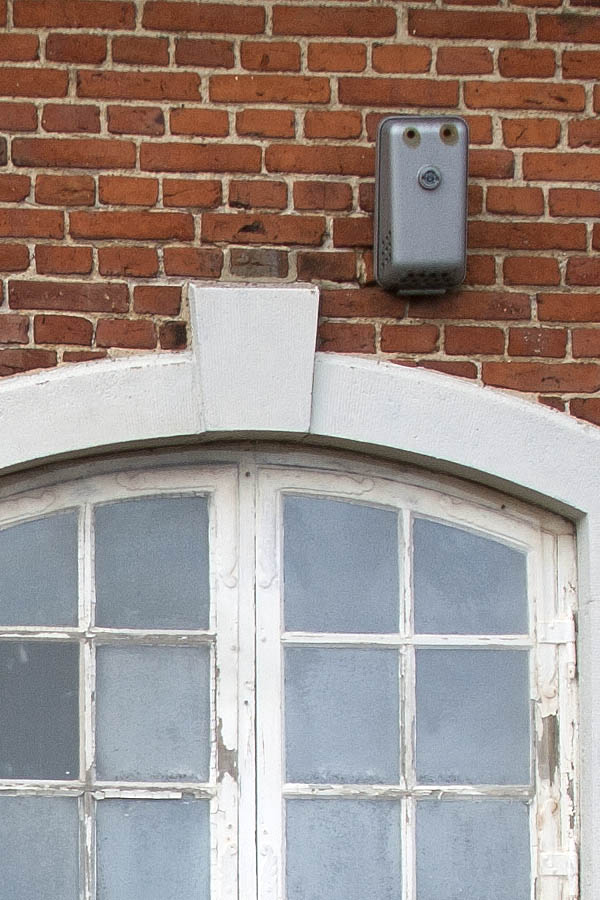 Photo 00774: Worn, formed black double door and windows with pilasters