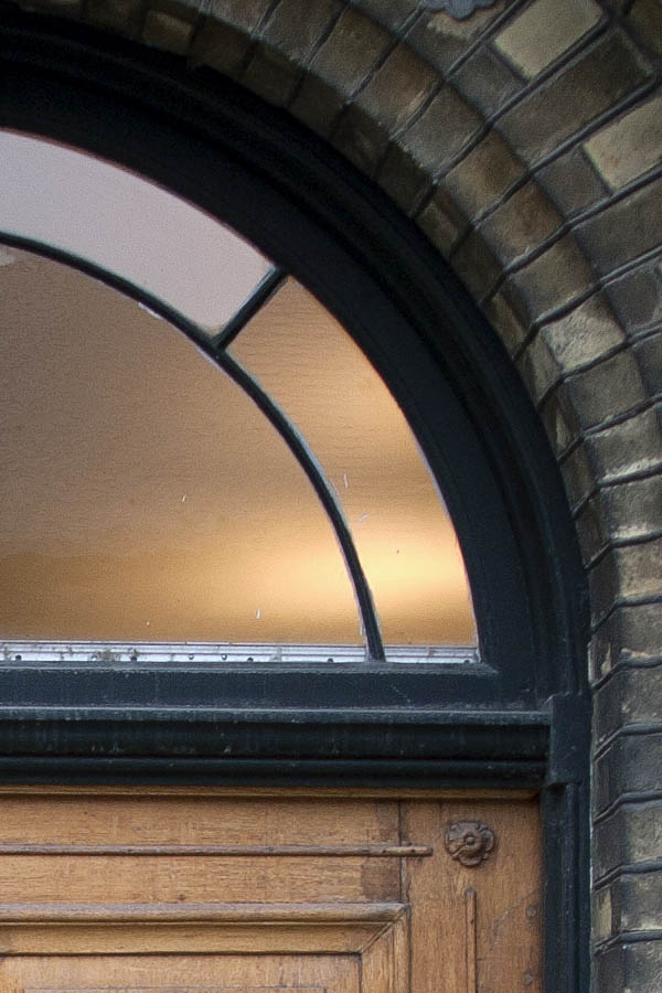 Photo 01384: Carved, oiled door with fan light