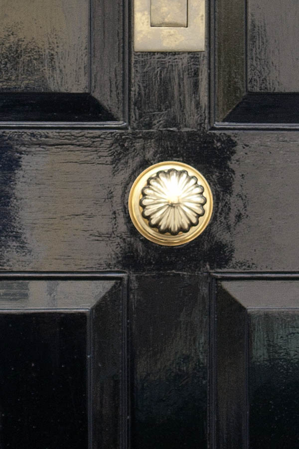 Photo 01527: Panelled, shiny black door with top window