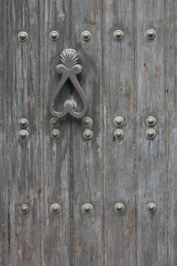 Photo 02615: Formed, oiled gate with minor door inserted and huge, marble pilaster