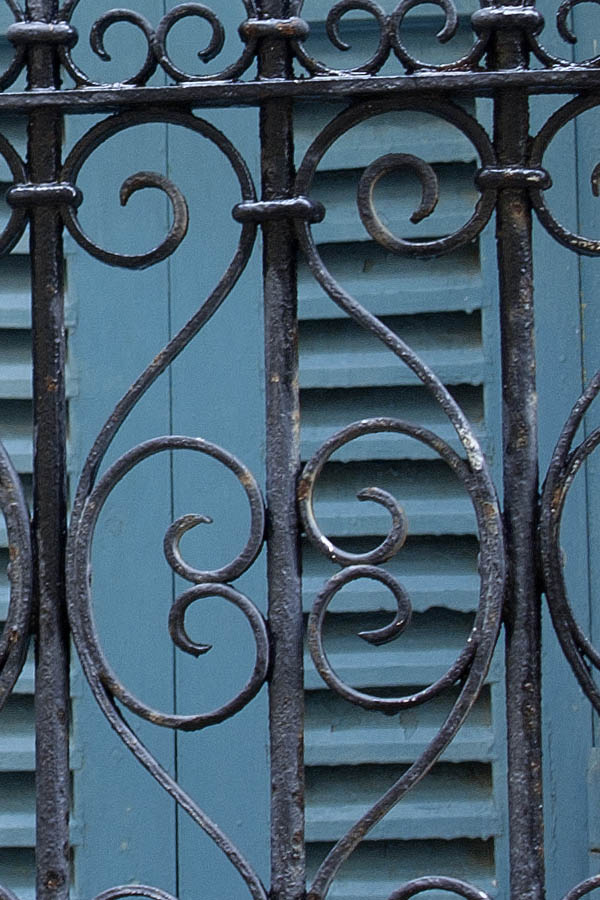 Photo 02704: Latticed, formed window with light blue shutters