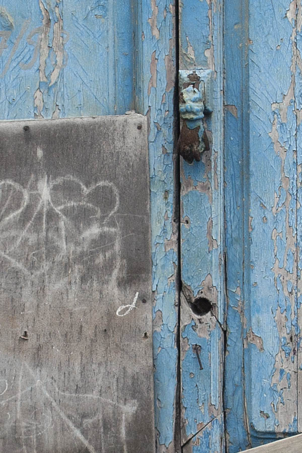 Photo 02733: Decayed, panelled, blocked, light blue double door with top window