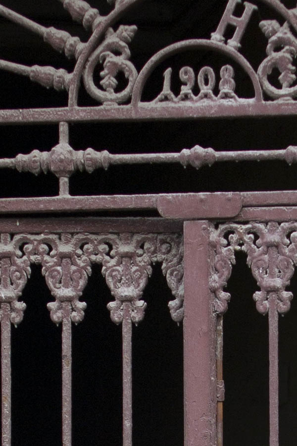 Photo 02789: Brown metal double door with lattice on top
