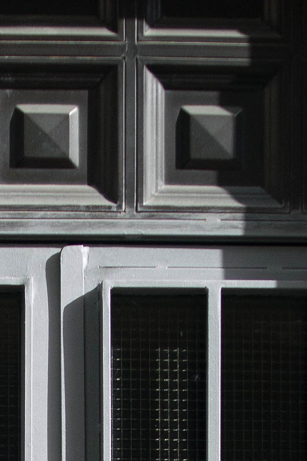 Photo 03293: New, panelled, grey, metal door with glass pane and sidepiece