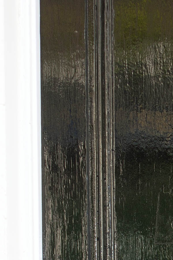Photo 04548: Panelled, shiny, black door