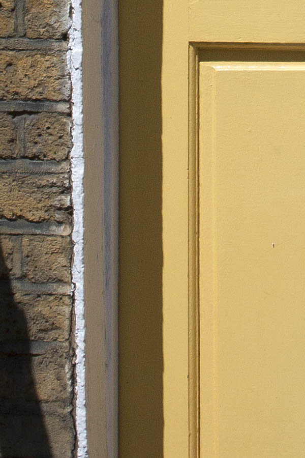 Photo 04581: Panelled, light yellow door with fan light