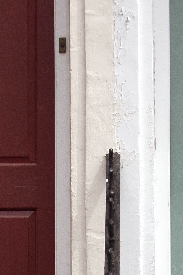 Photo 05010: Two red and light green panelled doors with top windows