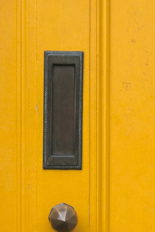 Photo 05028: Panelled, yellow door with top window