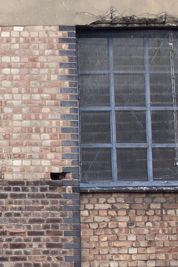 Photo 05040: Factory facade with large, blue, metal windows with lattice