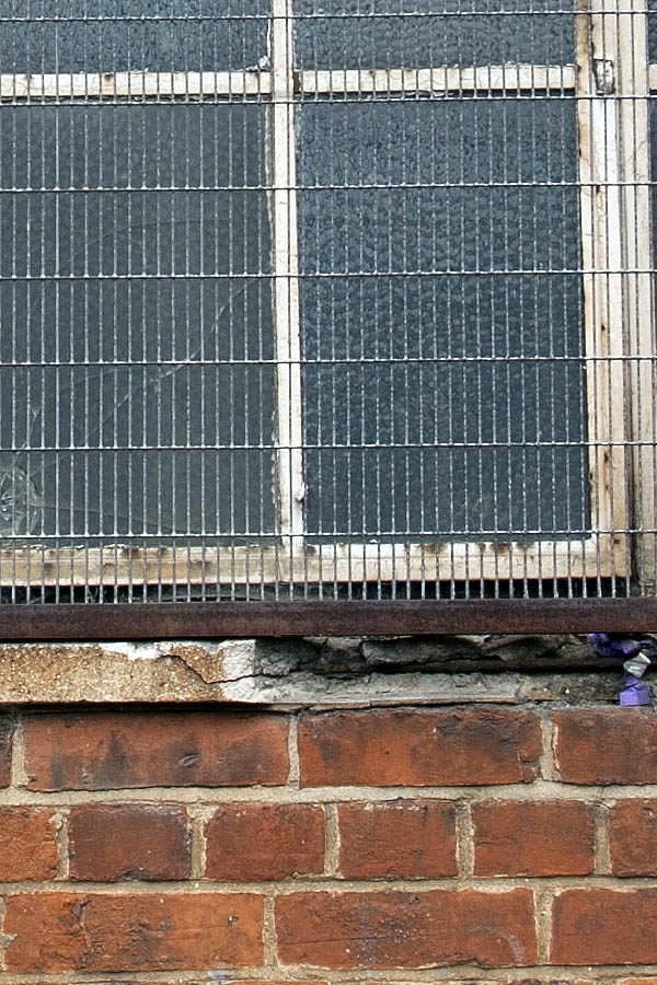 Photo 05174: Worn, large, white window with 25 panes and thin lattice