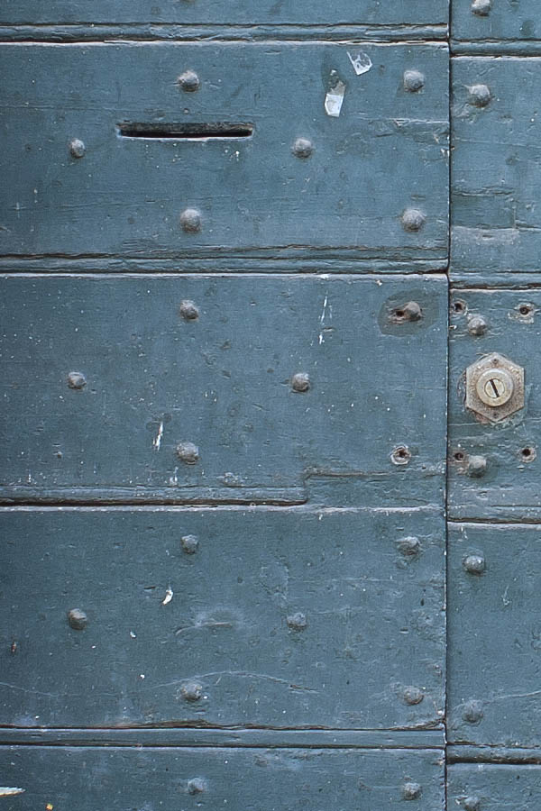 Photo 07969: Worn, teal double door made of planks with latticed fan light