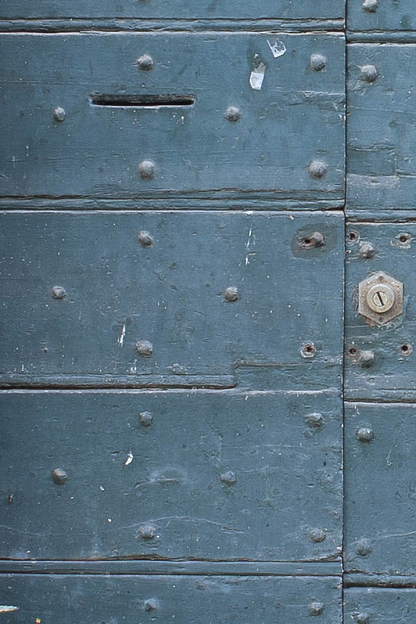 Photo 07969: Worn, teal double door made of planks with latticed fan light
