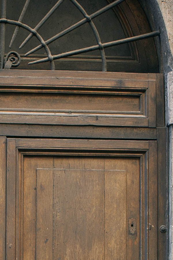 Photo 08041: Worn, panelled, oiled double door with fan light and pilaster