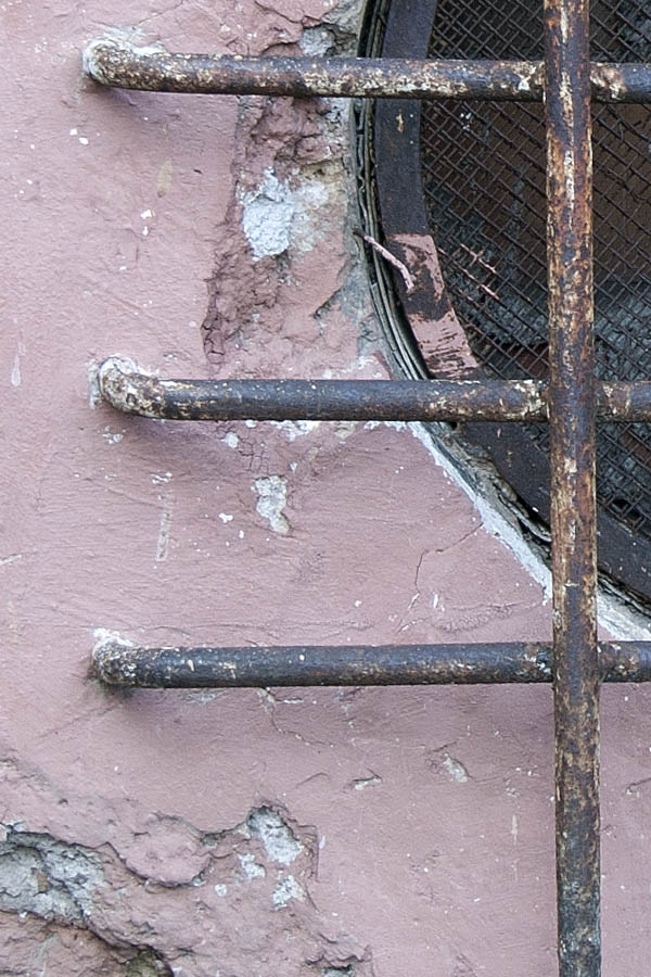 Photo 08184: Barred, brown, round window
