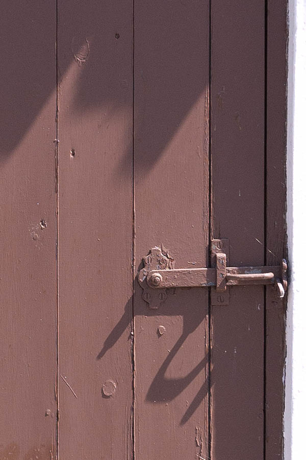 Photo 08674: Worn, brown door made of planks