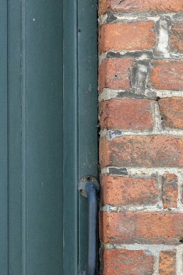 Photo 08760: Worn, panelled, teal door with top window