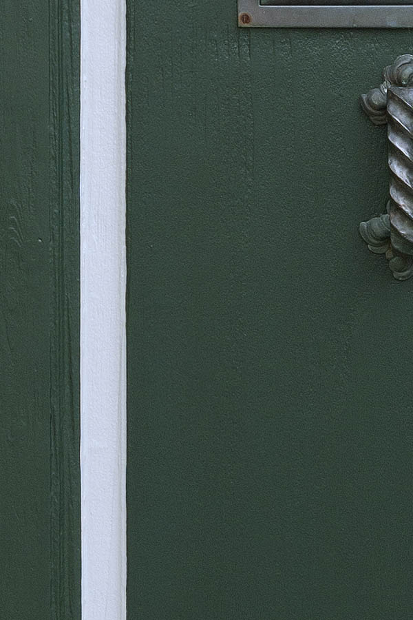 Photo 08790: Carved, panelled, green, white and red door