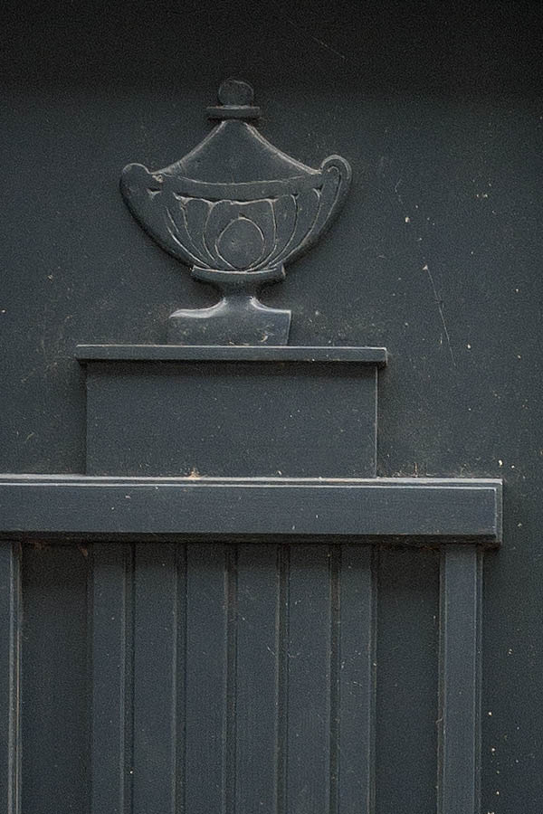 Photo 08825: Carved, panelled black double door with top window