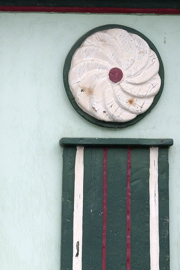 Photo 08861: Worn, carved, panelled, light green, green, white and red double door with top window