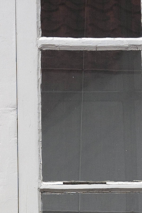 Photo 08929: Lopsided, grey window with two frames and 12 panes
