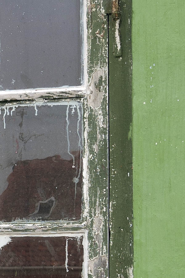 Photo 09073: Worn, green window with four frames and 16 panes