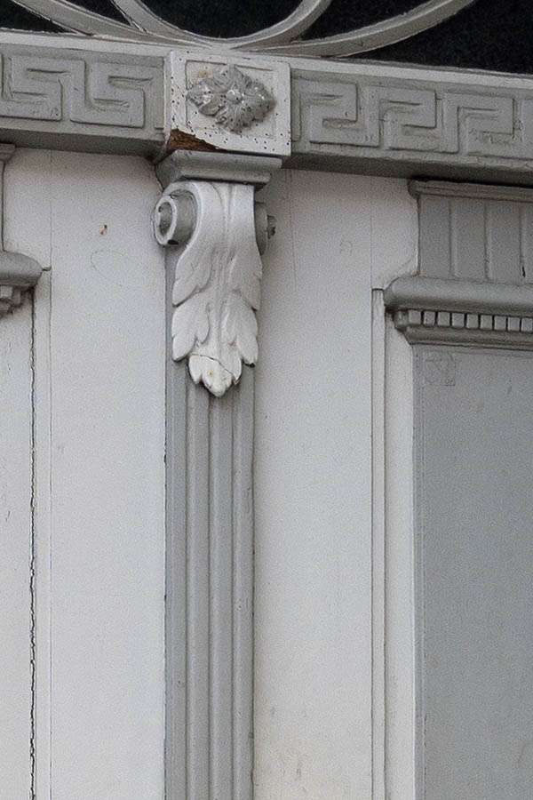 Photo 09202: Carved, panelled, grey and white double door with top window